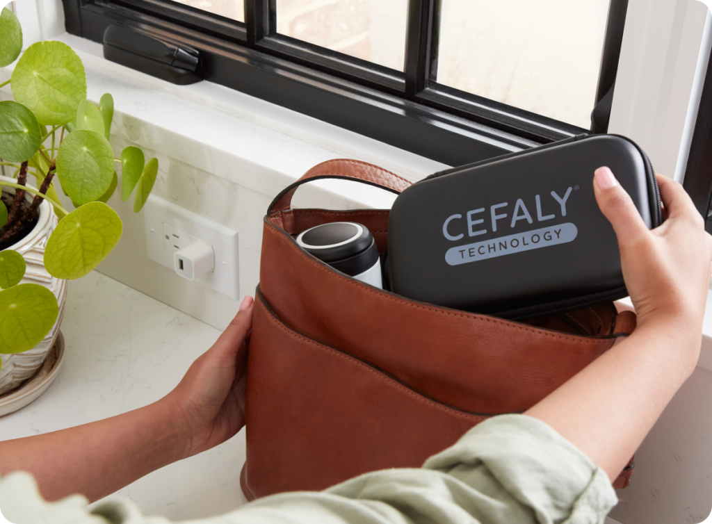 Women getting CEFALY device out of the hand bag.
